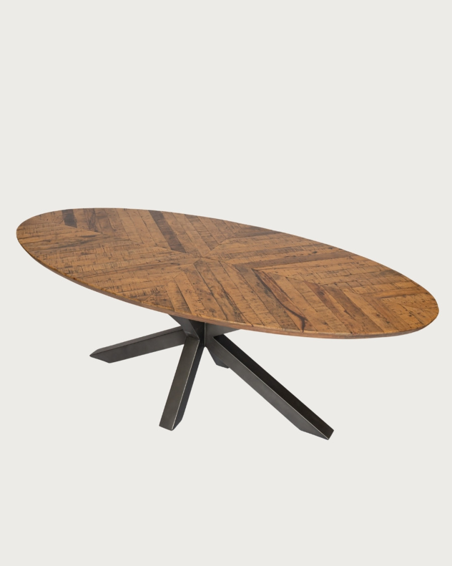 Apogee - Tavolo da pranzo ovale con piano in legno di mango a spina di pesce e base a stella in metallo.