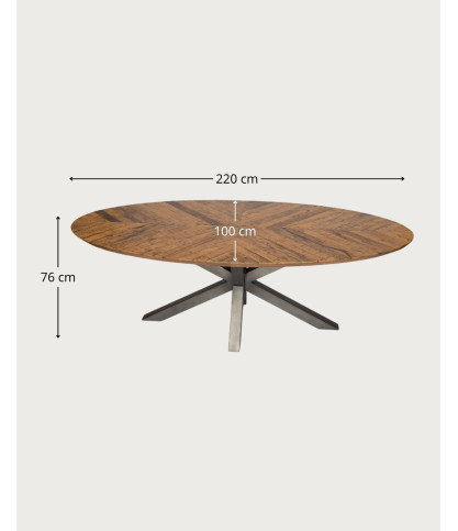 Apogee - Tavolo da pranzo ovale con piano in legno di mango a spina di pesce e base a stella in metallo.